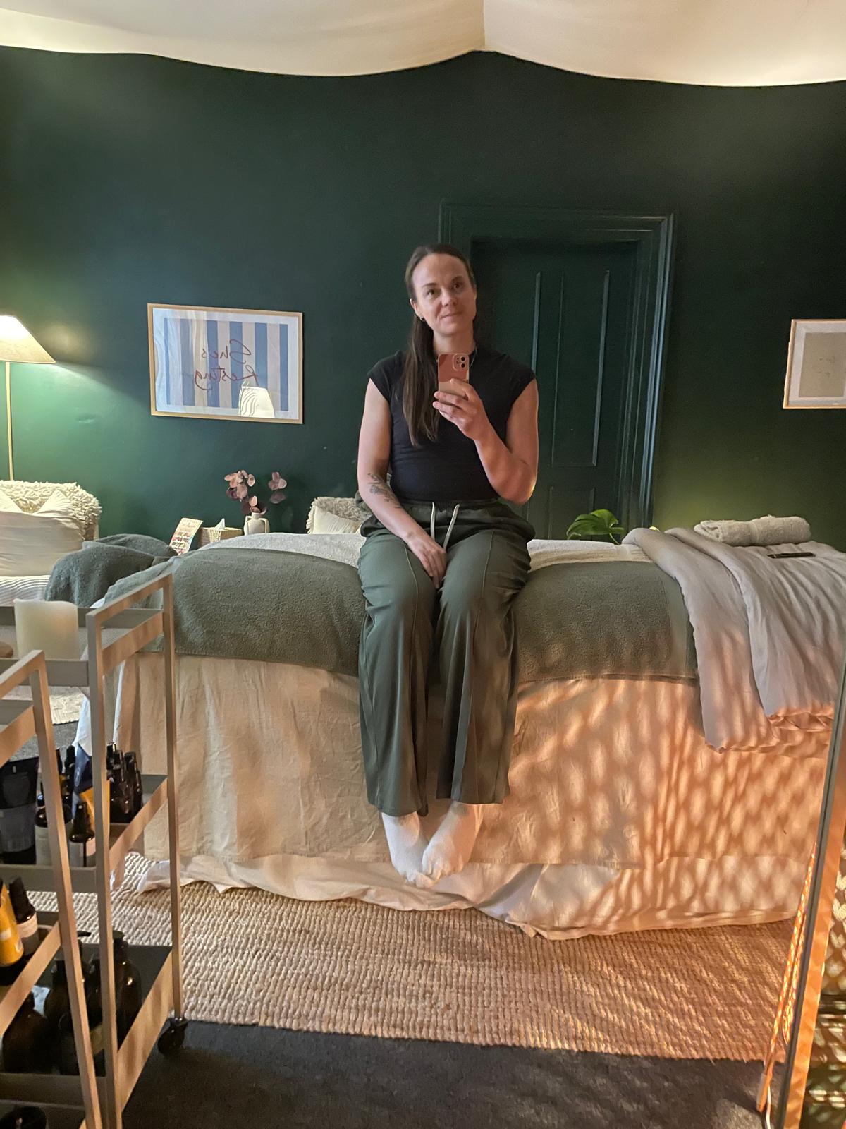 Bee, massage therapist, in her studio.